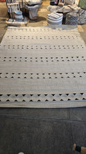 Load image into Gallery viewer, Full view of the braided jute rug with circle bands
