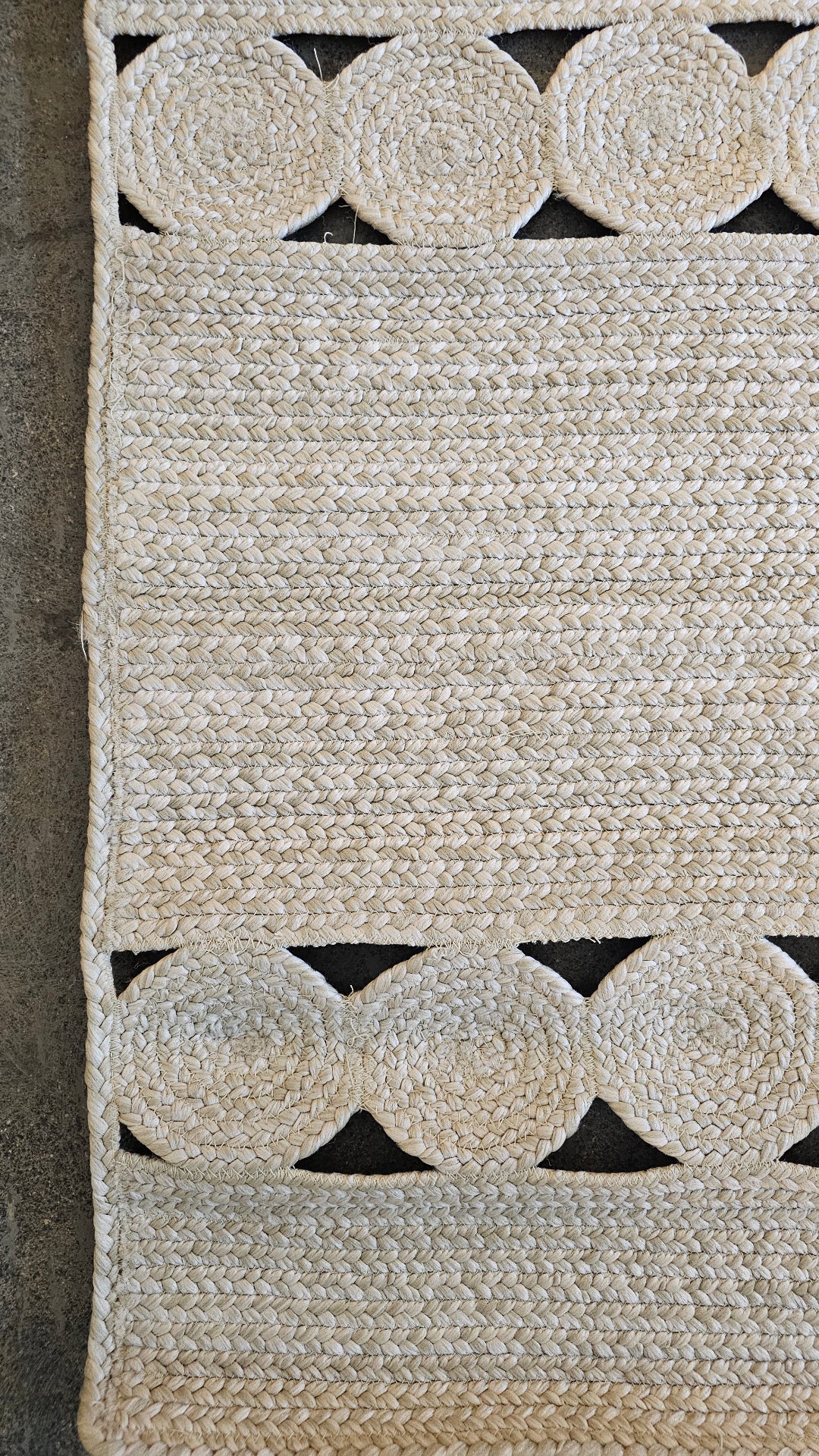 Close-up of jute braid and circle medallion detail